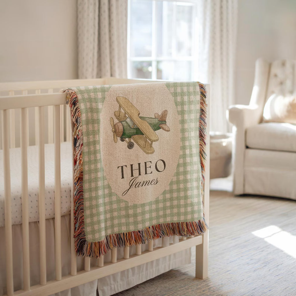 Custom airplane nursery blanket featuring a vintage airplane design, personalized woven cotton baby blanket with name
