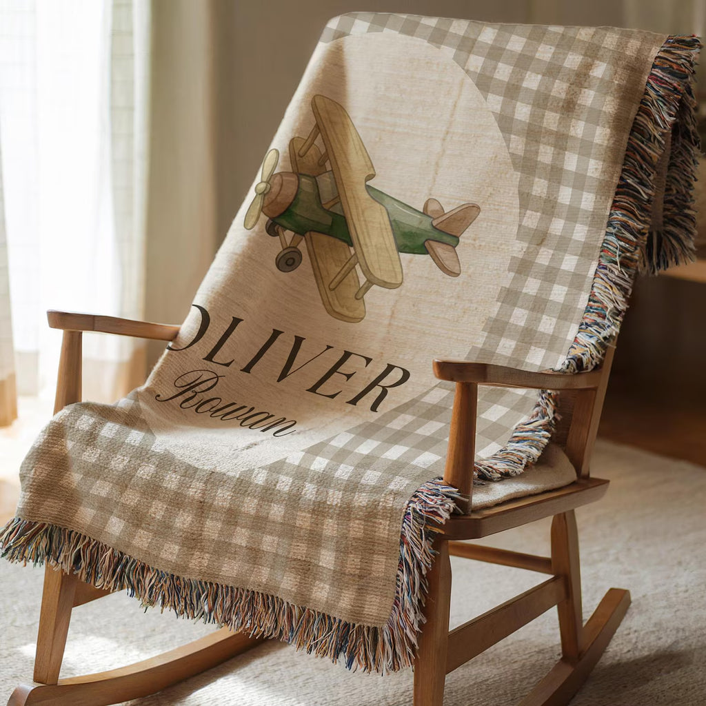 Airplane baby shower gift for boys, personalized woven cotton blanket with custom name and timeless aviation theme

